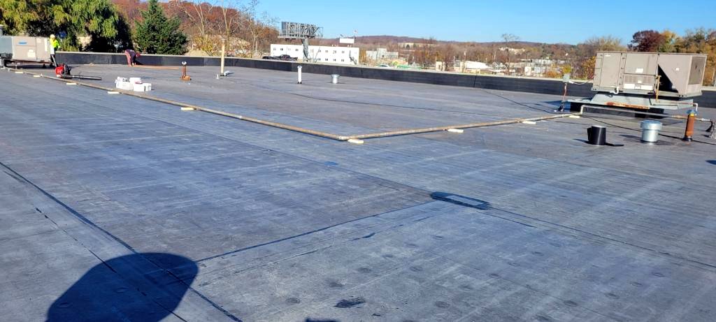 Commercial EPDM flat roof by E.M Construction