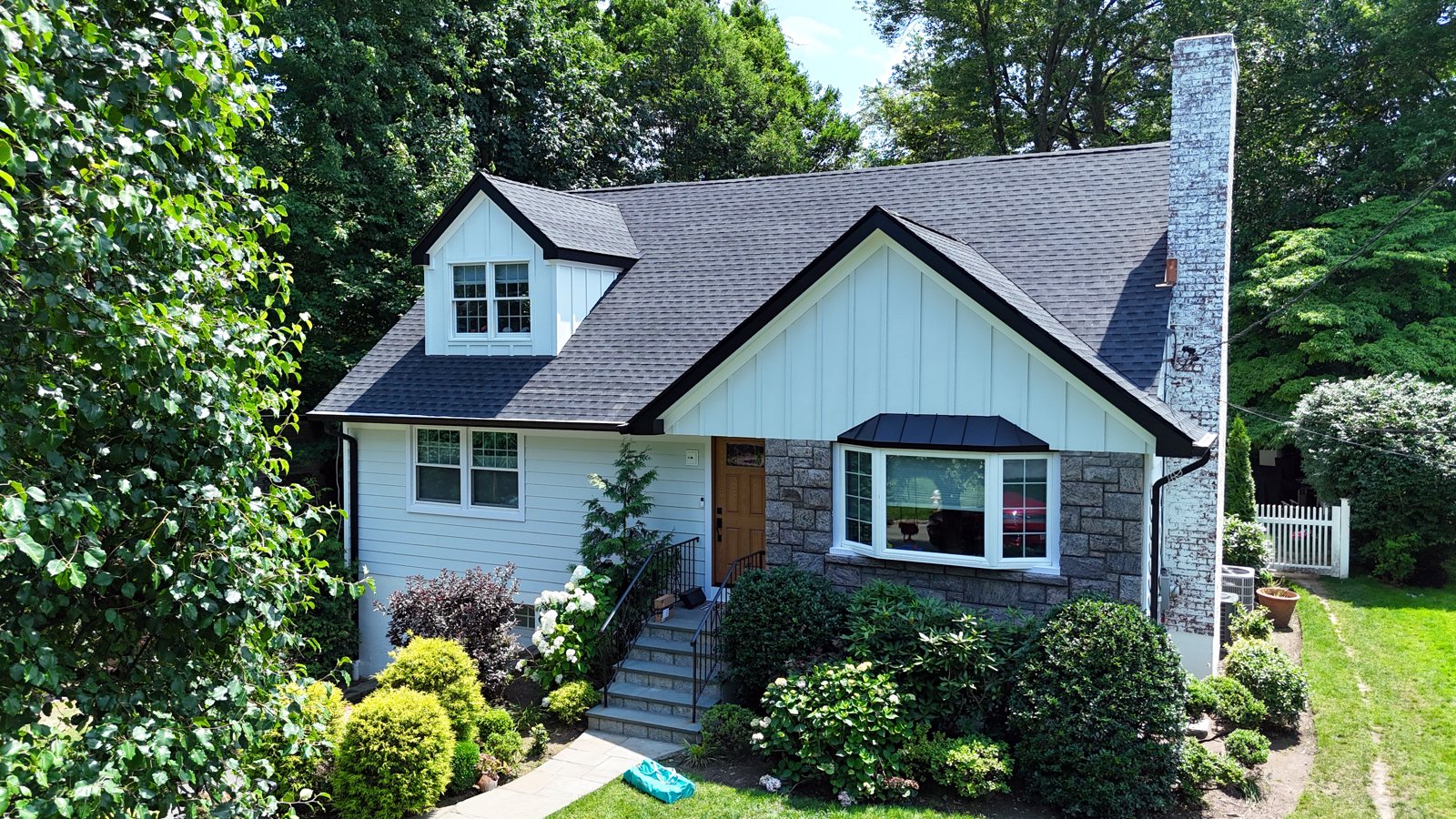 Full exterior renovation — new roof, siding and stone — Westchester, NY